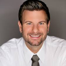 Tyson Zahner reviews his own story of being adopted. This image is of Tyson Zahner smiling in a headshot.